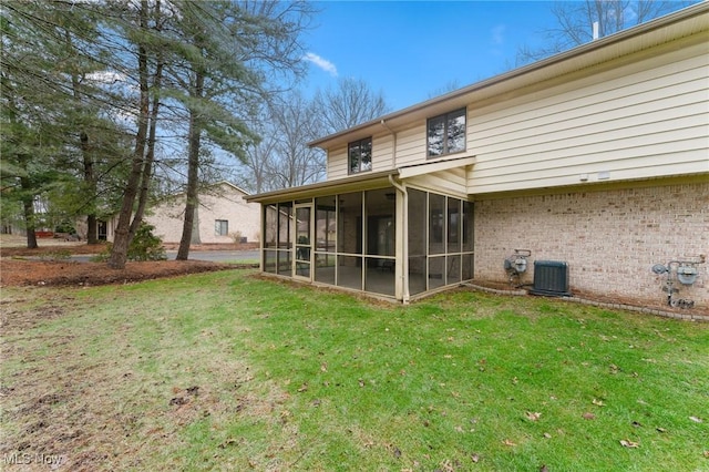 1260 Boardman-Canfield Rd # 29, Boardman, OH 44512 - rear view of property with a yard, a sunroom, and central air condition unit