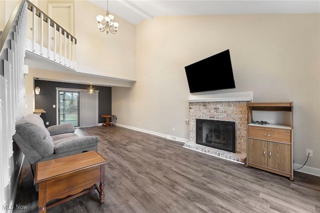 1260 Boardman-Canfield Rd # 29, Boardman, OH 44512 - living room with wood-type flooring, high vaulted ceiling, a brick fireplace, a notable chandelier, and beam ceiling