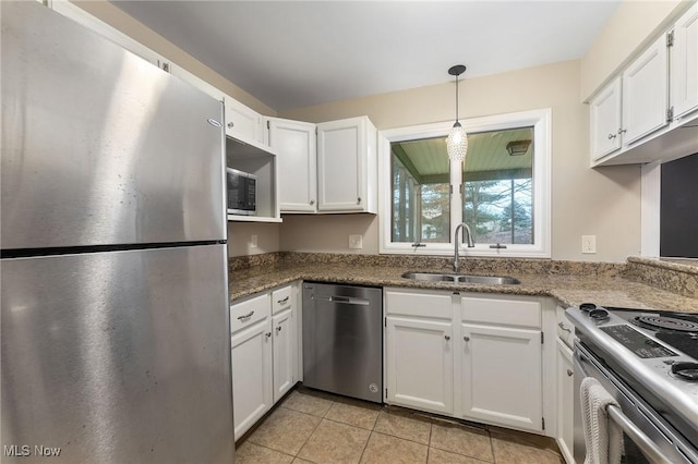 1260 Boardman-Canfield Rd # 29, Boardman, OH 44512 - kitchen featuring dark stone countertops, sink, stainless steel appliances, and white cabinets