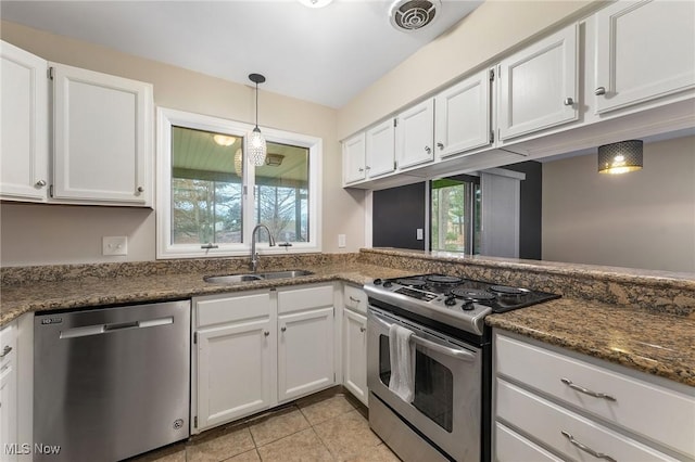 1260 Boardman-Canfield Rd # 29, Boardman, OH 44512 - kitchen with sink, appliances with stainless steel finishes, pendant lighting, dark stone counters, and white cabinets