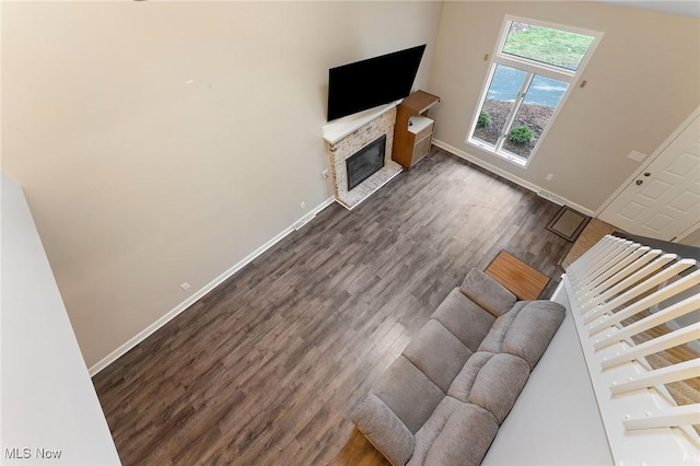 1260 Boardman-Canfield Rd # 29, Boardman, OH 44512 - unfurnished living room featuring dark hardwood / wood-style flooring and a stone fireplace