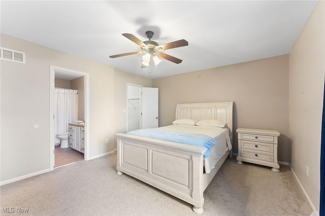 1260 Boardman-Canfield Rd # 29, Boardman, OH 44512 - bedroom with ensuite bathroom, light colored carpet, and ceiling fan