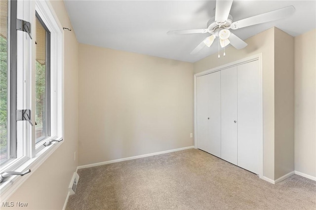 1260 Boardman-Canfield Rd # 29, Boardman, OH 44512 - unfurnished bedroom with ceiling fan, light colored carpet, and a closet