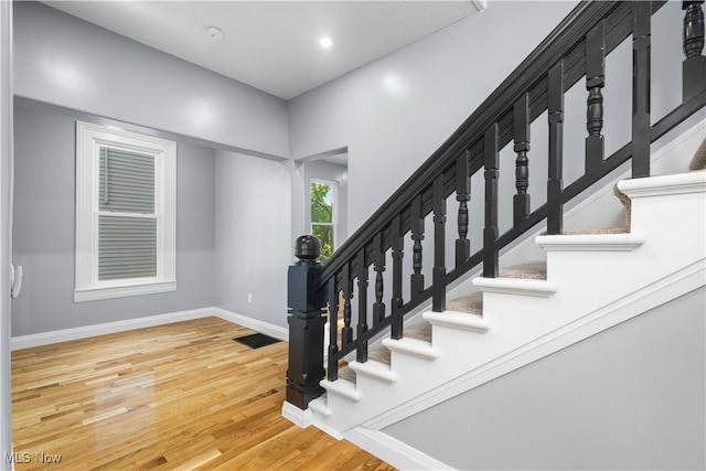 stairs with wood-type flooring