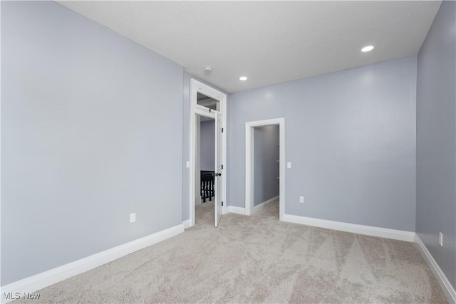 unfurnished bedroom with light carpet