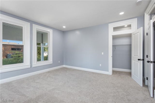 unfurnished bedroom with light carpet