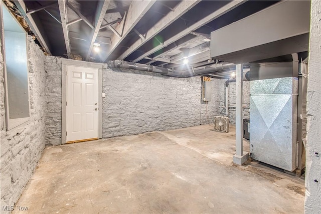 basement featuring heating unit