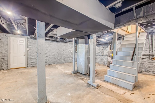 basement with heating unit and water heater