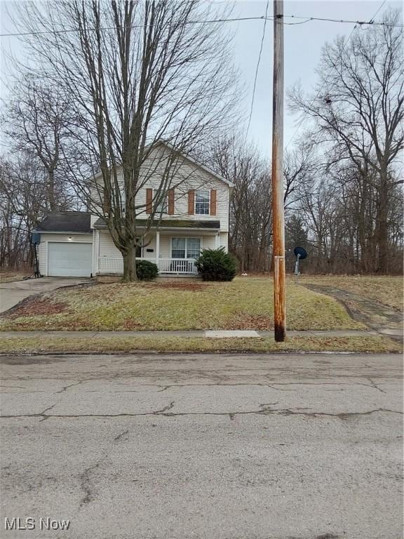 view of front of house featuring a garage and a front yard