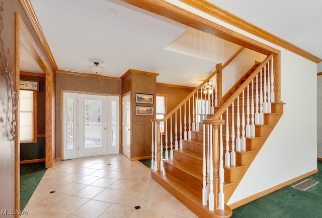 615 Crystal Brooke Dr, Hinckley, OH 44233 - carpeted foyer entrance with baseboards, crown molding, stairway, and tile patterned floors
