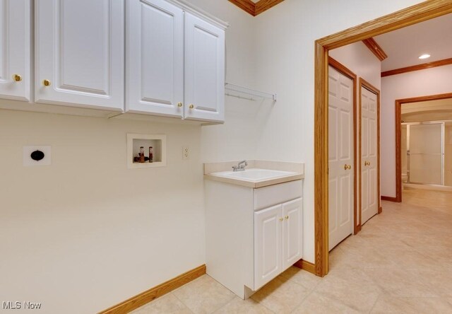 615 Crystal Brooke Dr, Hinckley, OH 44233 - laundry room featuring hookup for a washing machine, cabinet space, hookup for an electric dryer, crown molding, and baseboards