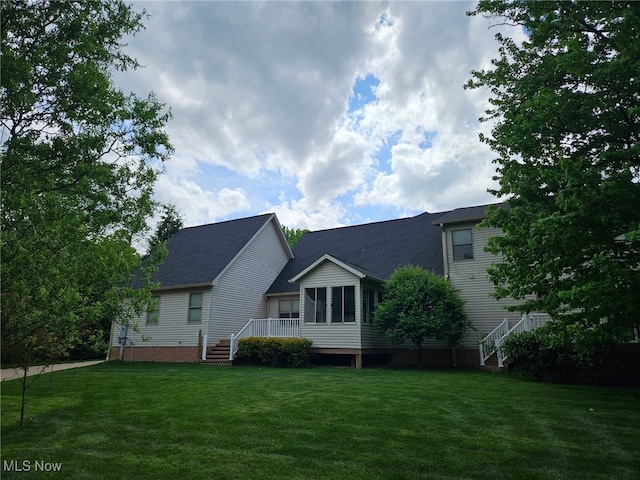 615 Crystal Brooke Dr, Hinckley, OH 44233 - view of front of home featuring a front yard, stairway, and roof with shingles