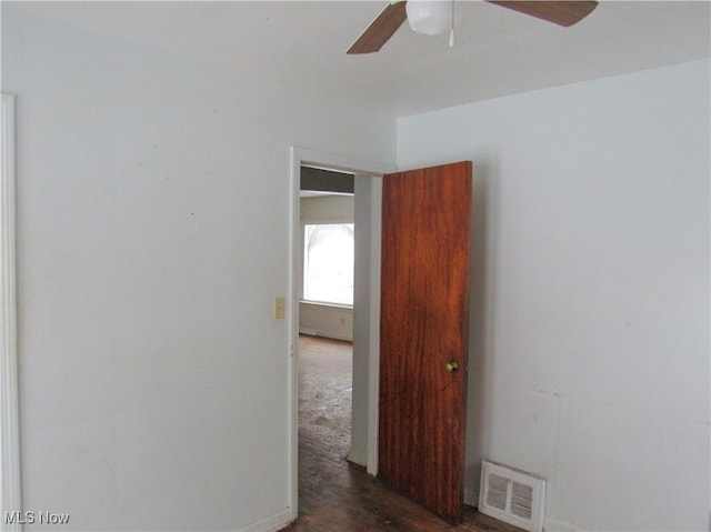 spare room featuring visible vents and a ceiling fan