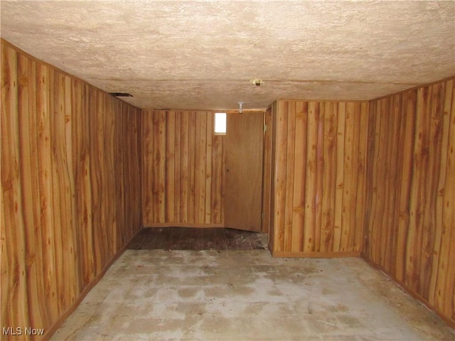 below grade area featuring wooden walls