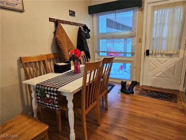 dining space featuring wood-type flooring