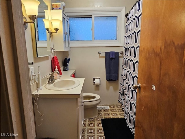 bathroom with vanity and toilet