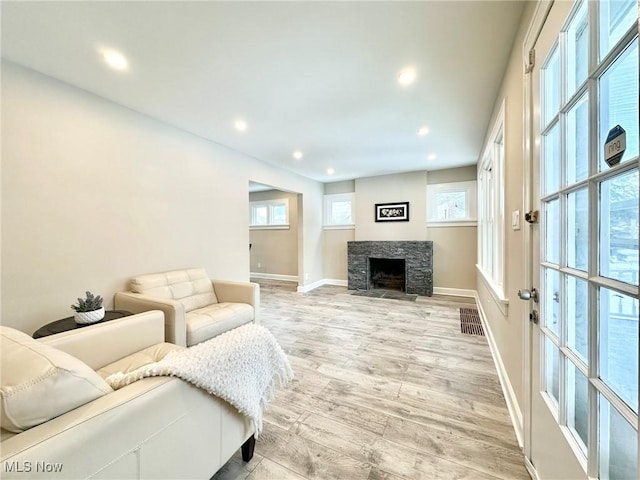 living room with light hardwood / wood-style flooring