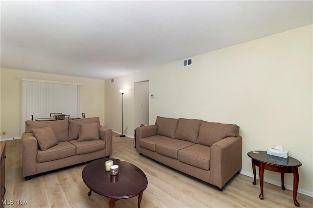 living room featuring light wood-type flooring