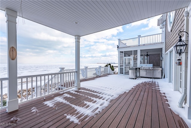 snow covered deck featuring ceiling fan