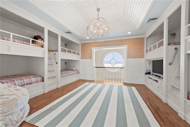 bedroom with hardwood / wood-style flooring, a raised ceiling, a notable chandelier, and wooden ceiling