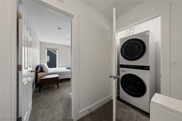 2280 City View Dr, Cleveland, OH 44113 - washroom featuring dark carpet and stacked washing maching and dryer