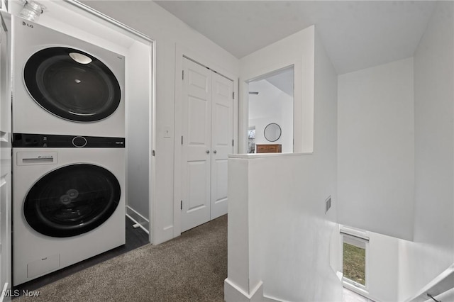 2280 City View Dr, Cleveland, OH 44113 - laundry room with dark colored carpet and stacked washer and clothes dryer