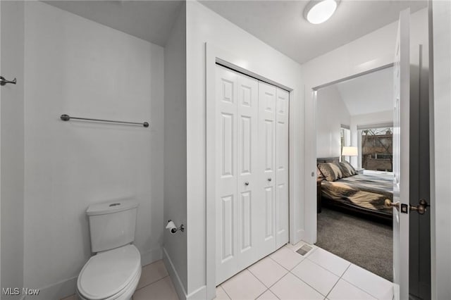 2280 City View Dr, Cleveland, OH 44113 - bathroom with lofted ceiling, tile patterned floors, and toilet