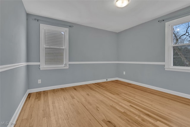 spare room with light hardwood / wood-style floors