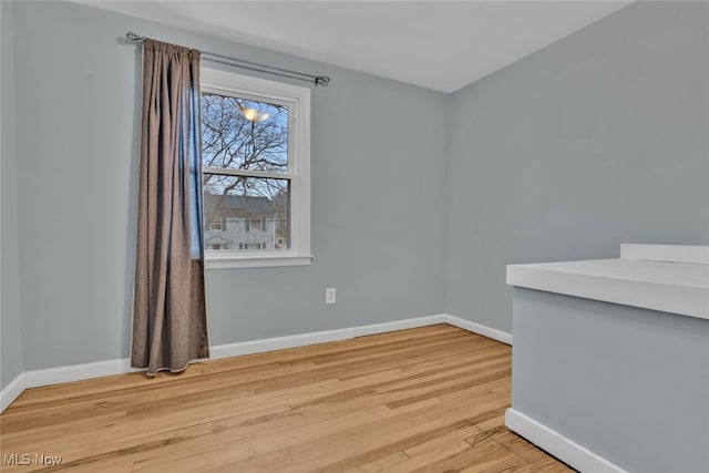 empty room with light hardwood / wood-style floors