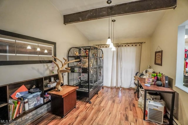 interior space with wood-type flooring and lofted ceiling with beams