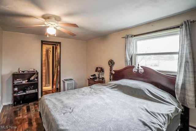 bedroom featuring ceiling fan and dark hardwood / wood-style flooring