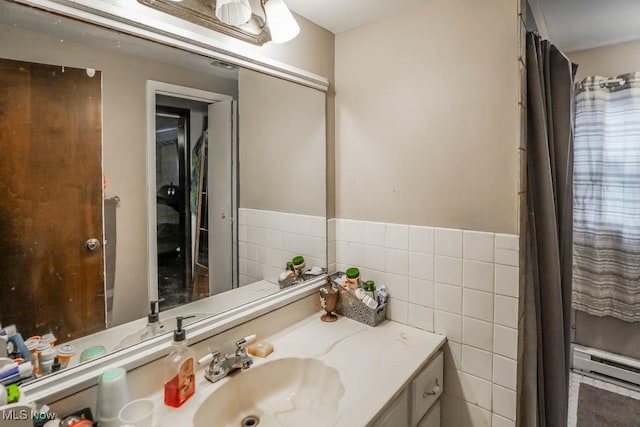 bathroom with tile walls and vanity