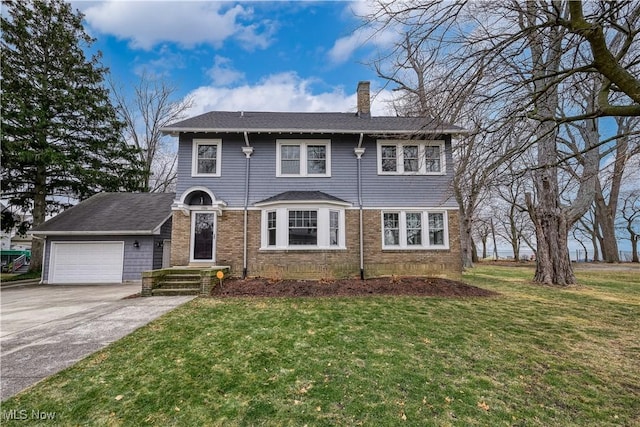 view of front of property with a garage and a front yard