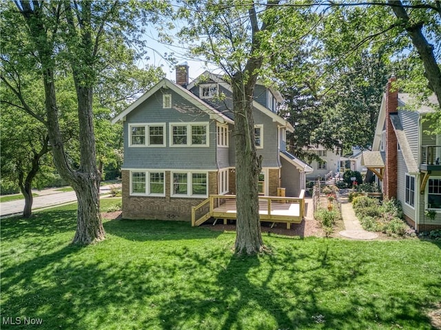 17728 Windward Rd, Cleveland, OH 44119 - rear view of property with a lawn and a wooden deck