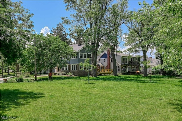 17728 Windward Rd, Cleveland, OH 44119 - view of grassy yard featuring a wooden deck