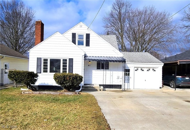 view of front of house featuring a garage and a front lawn