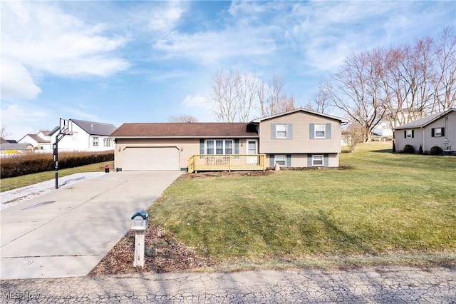 view of front of home with a garage and a front yard