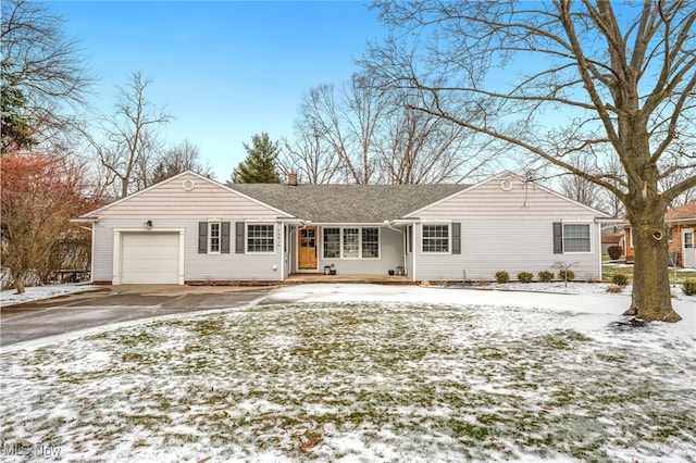 ranch-style home with a garage