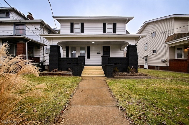 view of front facade with a porch and a front lawn