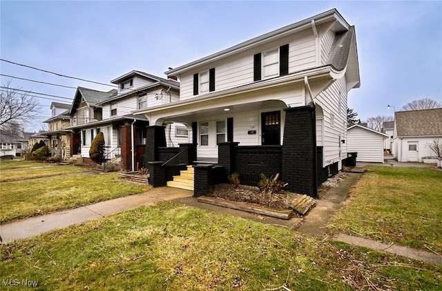 view of front of home featuring a front yard and a porch