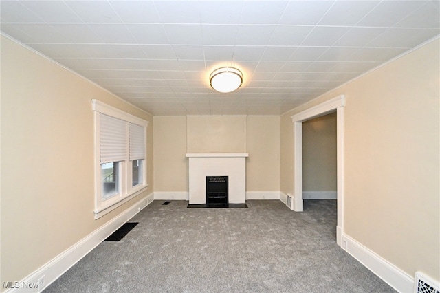 unfurnished living room with light colored carpet