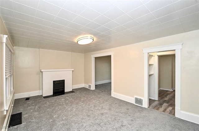 unfurnished living room with carpet