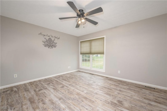 1145 Cookhill Cir, Akron, OH 44312 - unfurnished room featuring baseboards, visible vents, and wood finished floors