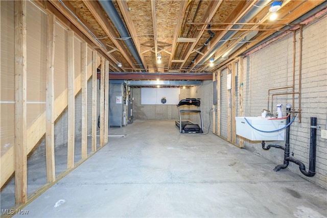 1145 Cookhill Cir, Akron, OH 44312 - unfinished below grade area with heating unit and a sink