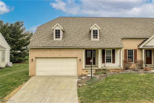 view of front of house with a garage and a front lawn