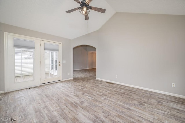 1145 Cookhill Cir, Akron, OH 44312 - empty room with arched walkways, baseboards, ceiling fan, and wood finished floors