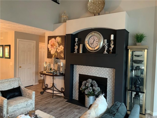 1145 Cookhill Cir, Akron, OH 44312 - living area with wood finished floors and a fireplace with flush hearth