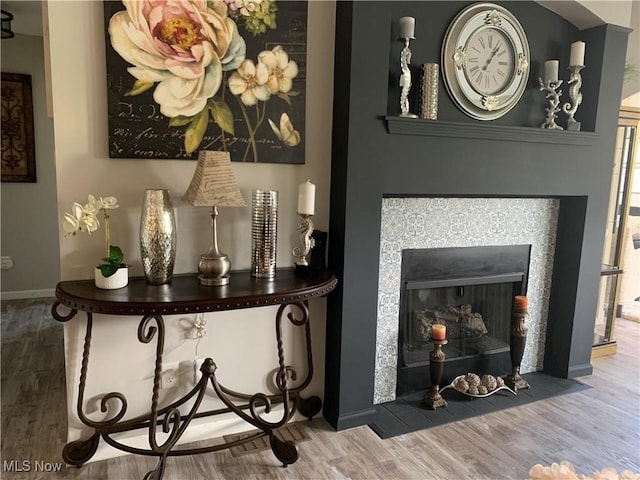 1145 Cookhill Cir, Akron, OH 44312 - room details featuring baseboards, a fireplace, and wood finished floors