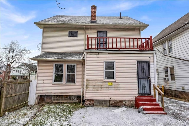 rear view of house featuring a balcony