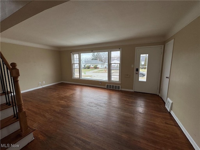 unfurnished living room with dark hardwood / wood-style floors